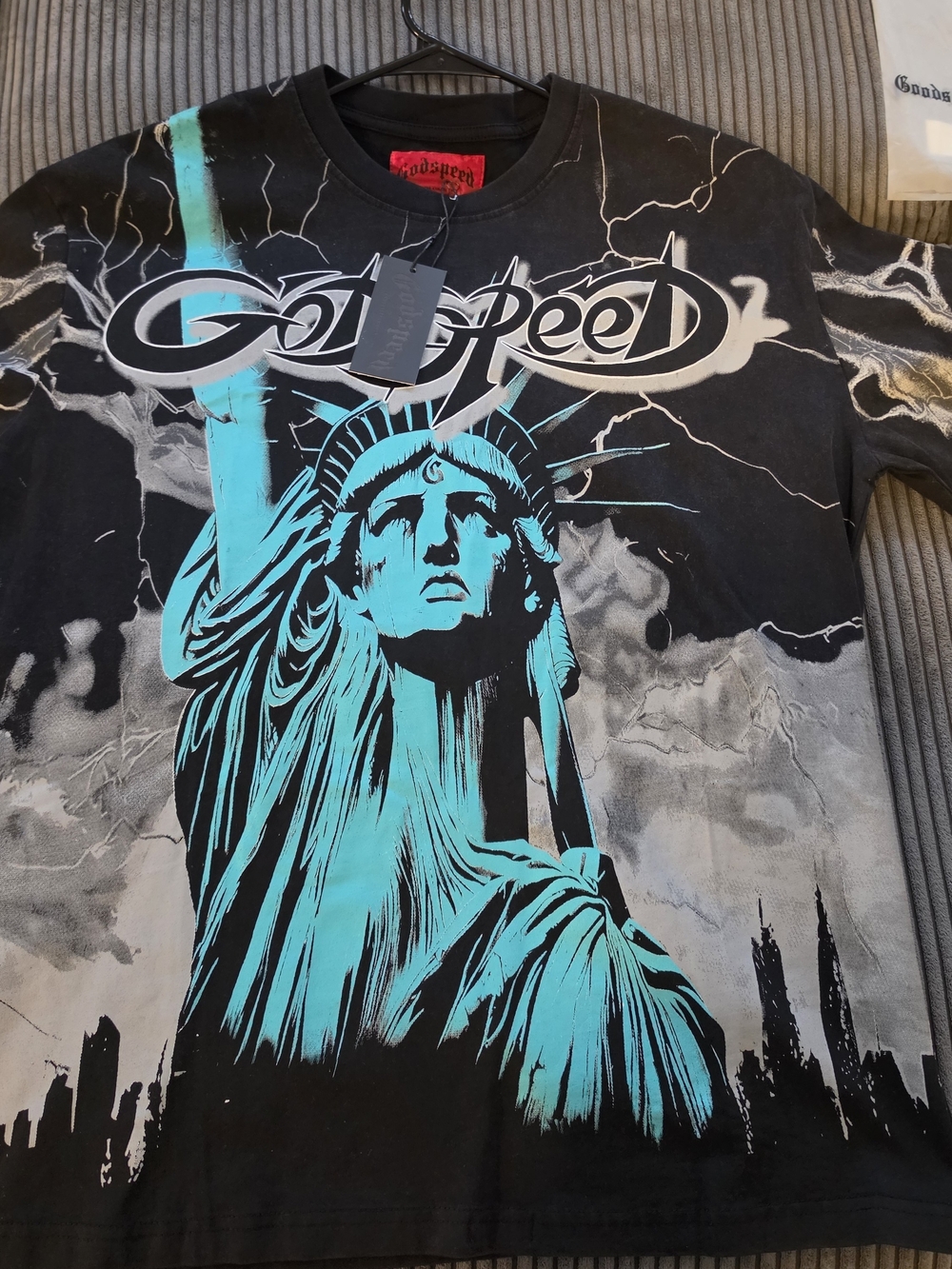 GoodSpeed Men's Black Short-Sleeve Tee with Teal Statue Graphic